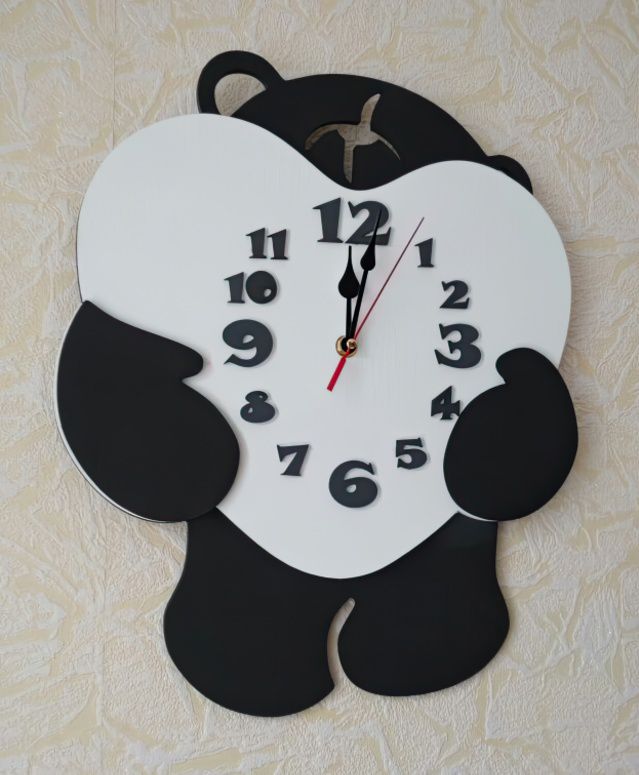 Bear shaped clock embracing heart