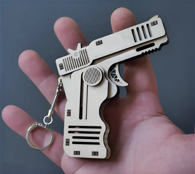 Gun keychain E0023454 file cdr and dxf pdf free vector download for Laser cut